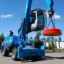 En blå materialhanterare som tillhör företaget Kuusakoski, materialhanteraren är utrustad med magnet och generator.