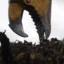 Närbild på käften på en stubbklipp till grävmaskin.